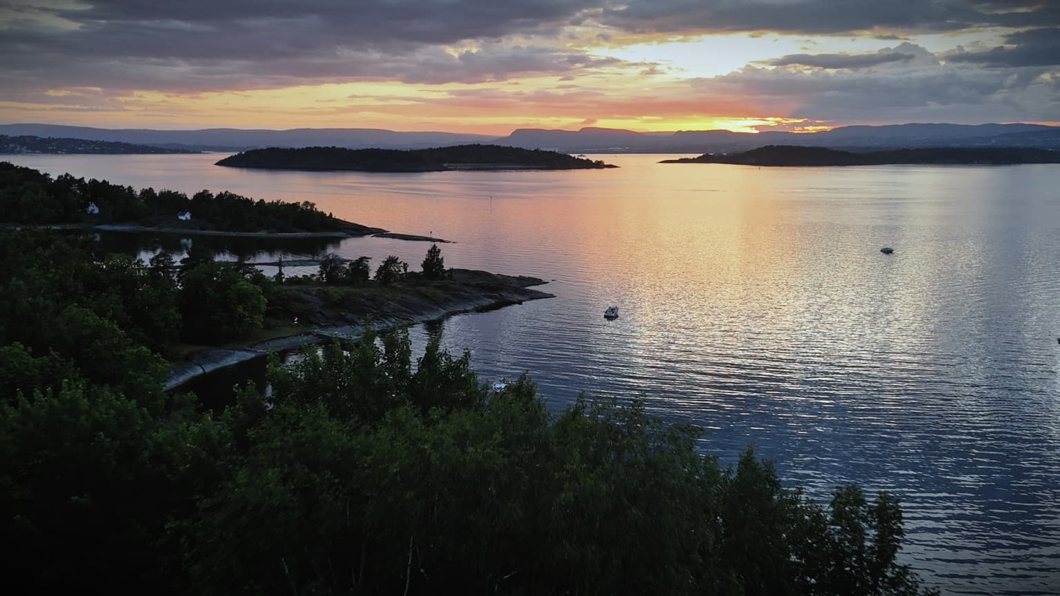 Sunset over the Oslofjord islands with golden light on the water
