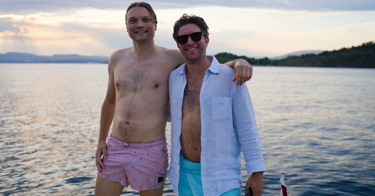 Two guests back on deck after a swim in the fjord