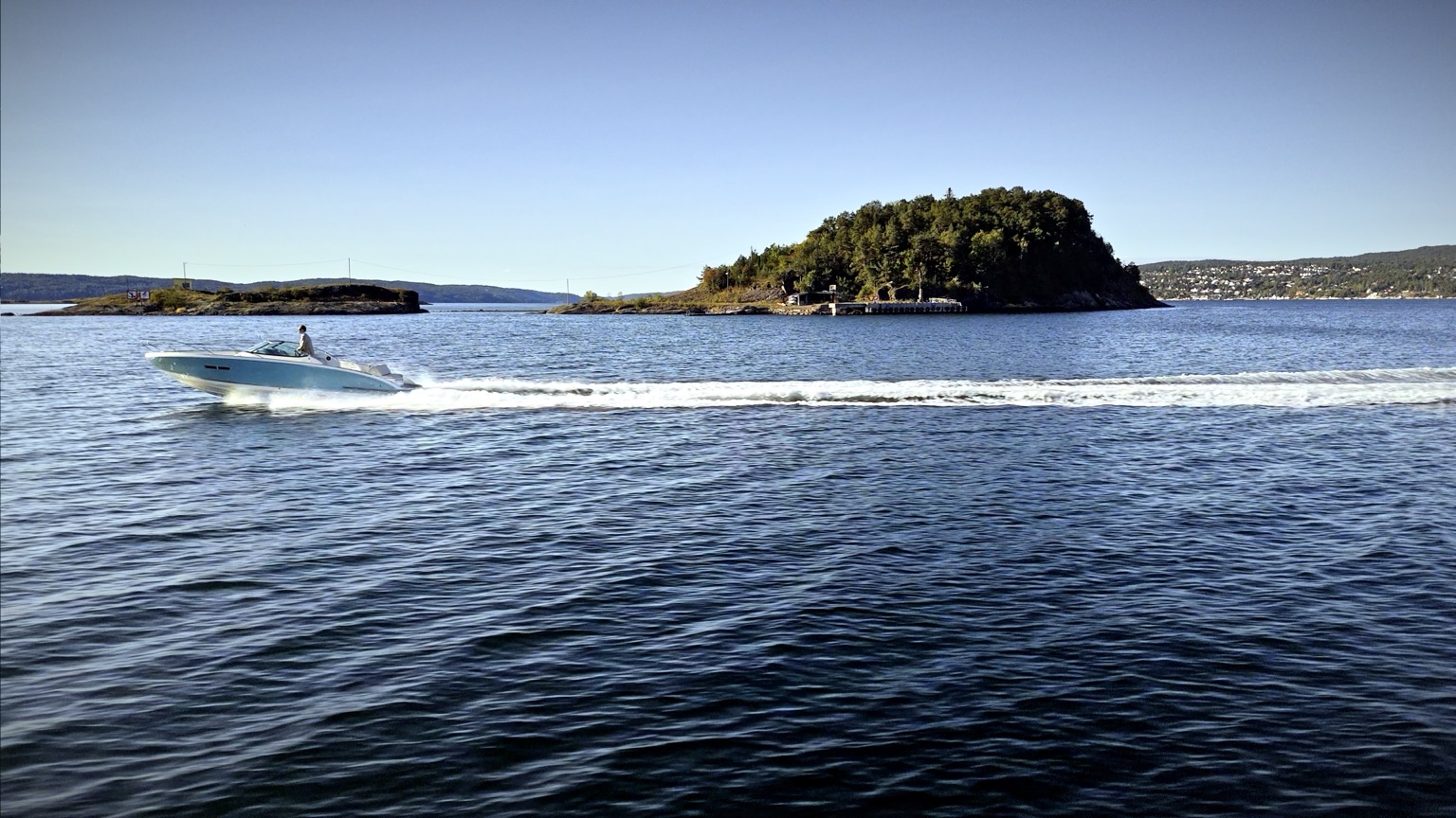 Cruising past a green island on the Oslofjord