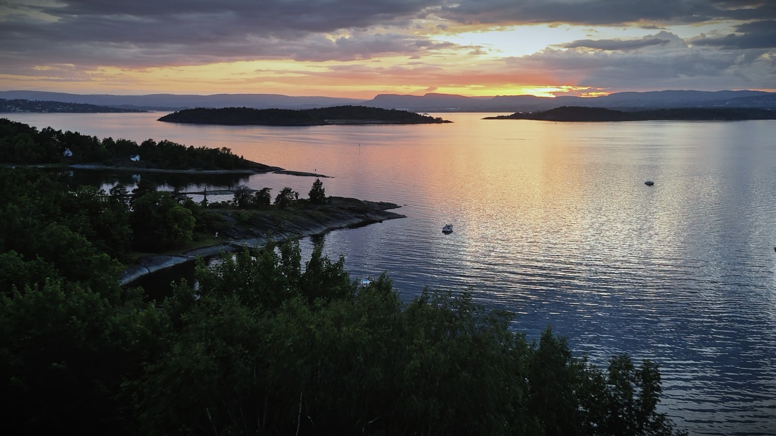 Sunset over the Oslofjord islands with golden light on the water