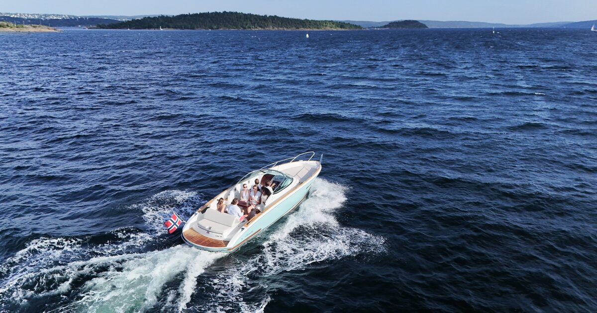 A lone boat on the open fjord