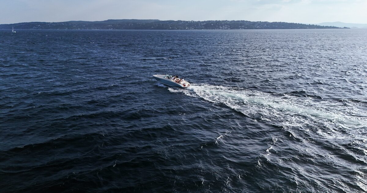 Calm, open fjord with a steady horizon line