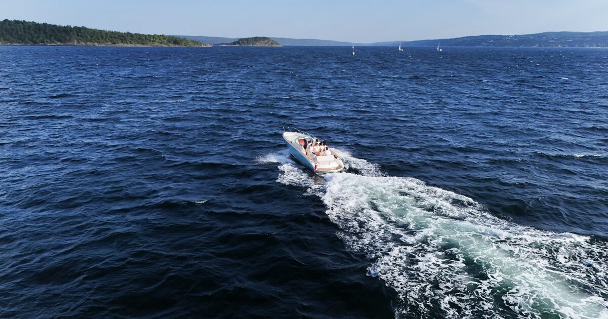 Following the boat's wake across open water